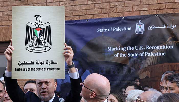 Husam Zomlot, head of the Palestinian mission to the United Kingdom, holds up a plaque which reads Embassy of the State of Palestine during a ceremony after the British government announced formal recognition of a Palestinian state in London, Britain, September 22, 2025. — Reuters