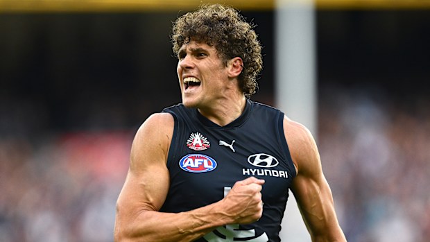 Charlie Curnow of the Blues celebrates kicking a goal.