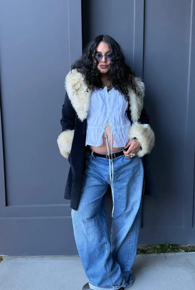 Vanessa Hudgens / Instagram Hudgens showing off her bump in a boho blouse and jeans