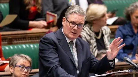 House of Commons Sir Keir Starmer raises his hand to make a point at the Commons despatch box