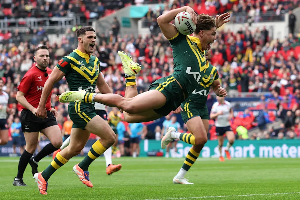 Reece Walsh celebrates scoring the opening try.