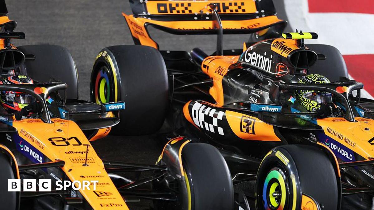 A close-up image of Lando Norris passing McLaren team-mate Oscar Piastri at the start of the Singapore Grand Prix