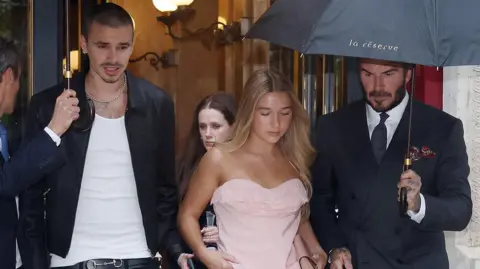 Getty Images David Beckham, Romeo Beckham and Harper Beckham leaving their hotel ahead of the Victoria Beckham Fashion show during the Womenswear Spring Summer 2026 as part of Paris Fashion Week on October 03, 2025 in Paris, France.
