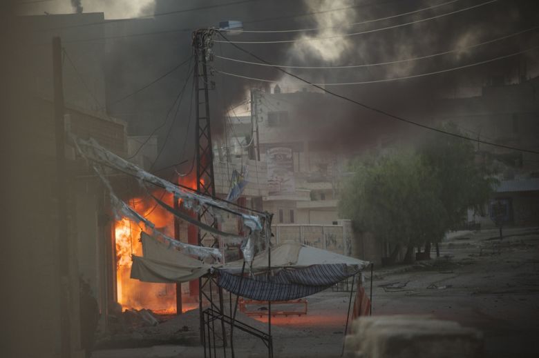 Tice captured this image of a fire raging along a street in Kafer Zaita in early June 2012.