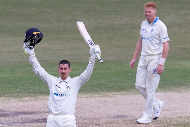 Nic Maddinson celebrates notching a ton for Victoria against NSW in 2020. 