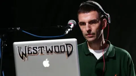 PA Media Tim Westwood performing on stage