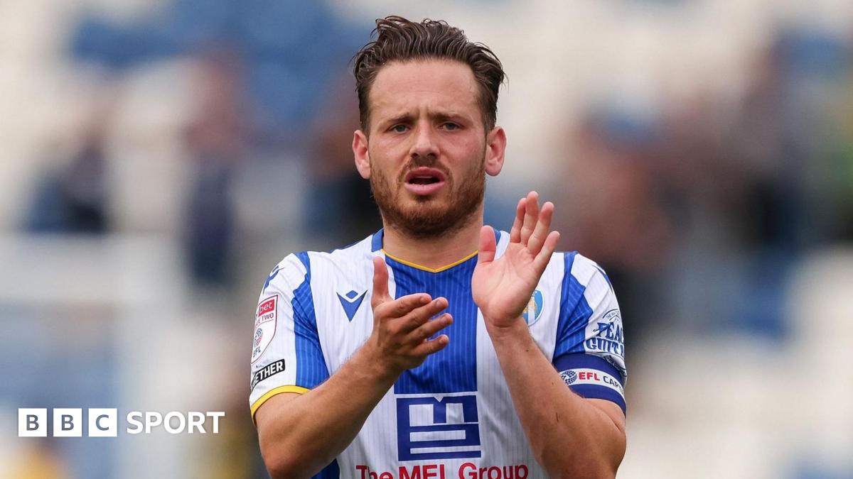 Jack Payne applauds Colchester United's supporters