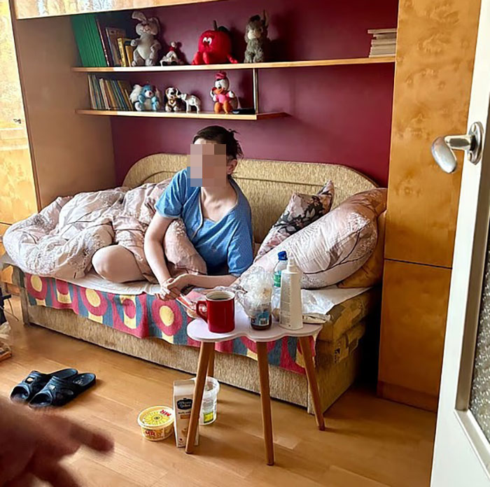 Teen missing 27 years found living in parents’ house in distressing and neglected condition on a cluttered couch.