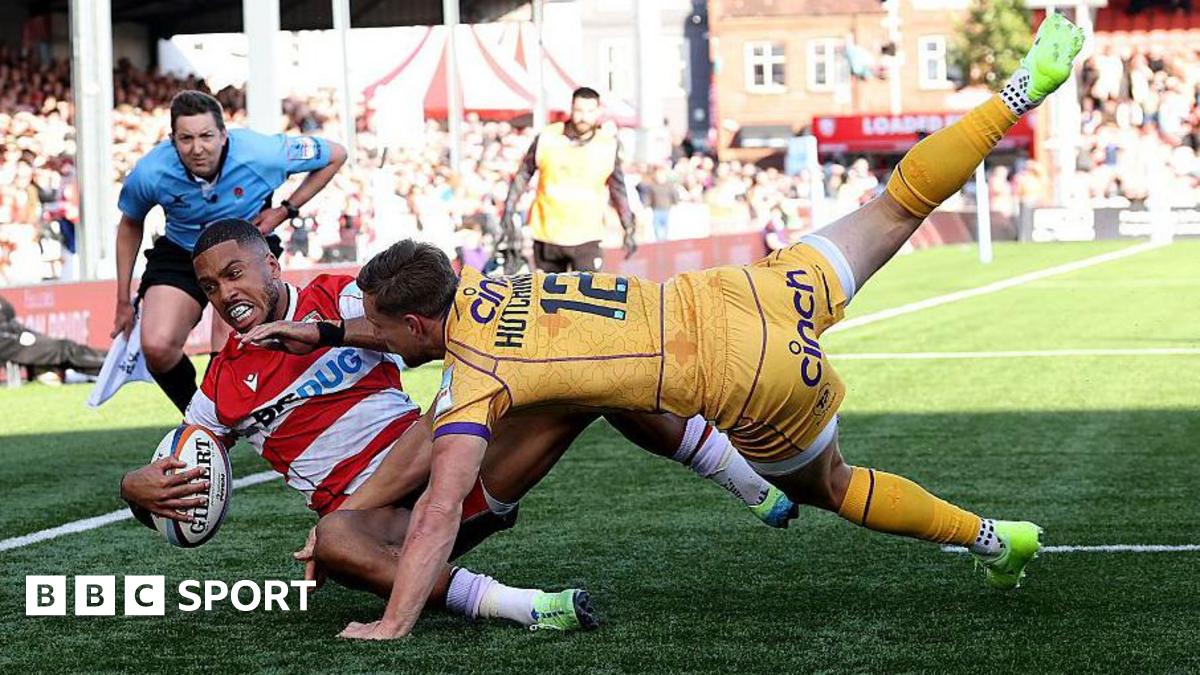Northampton Saints player Rory Hutchinson tackles Gloucester's Ben Loader to prevent a try.