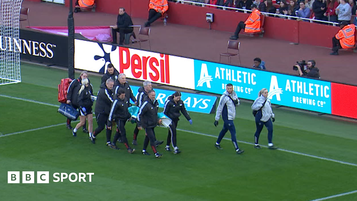 Harry Kane claps while playing for England