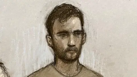 PA Media A court sketch of Mohammed Sharwarq, who has dark hair and a beard. He is wearing a light grey jumper.