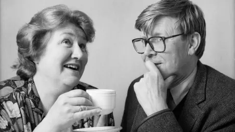 Patricia Routledge and Alan Bennett having a cup of tea