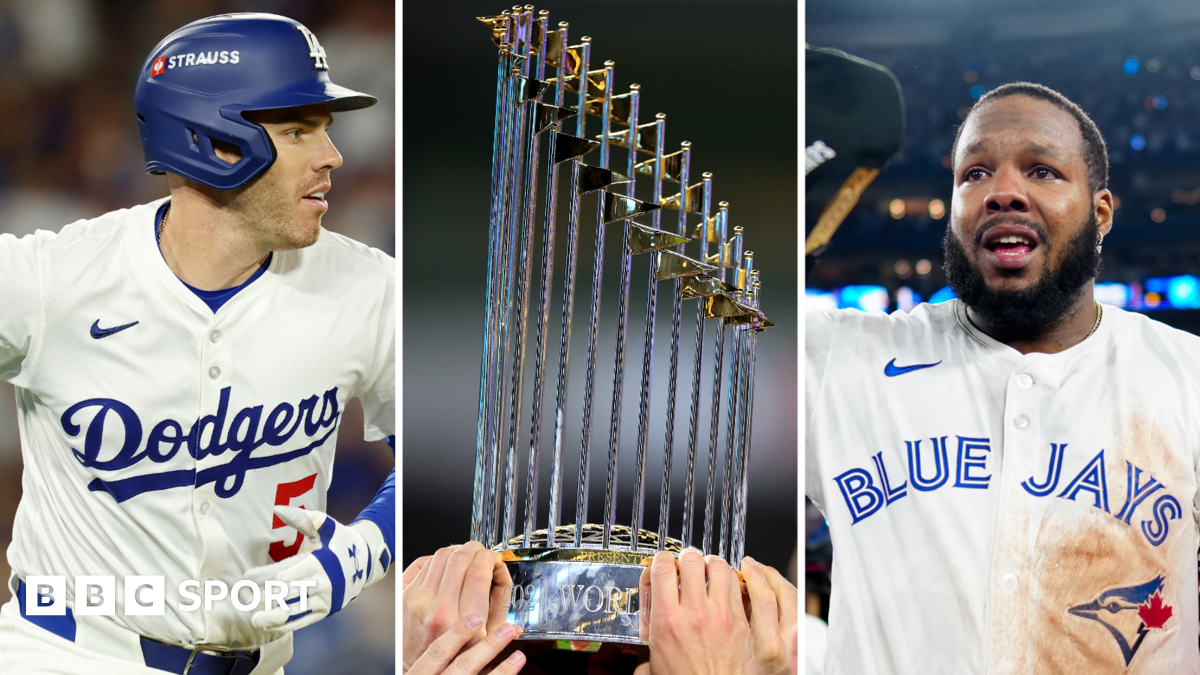 Los Angeles Dodgers first baseman Freddie Freeman, the World Series trophy, and Toronto Blue Jays first baseman Vladimir Guerrerro Jr