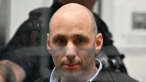 LIONEL BONAVENTURE/AFP Cedric Jubillar is pictured in the courtroom of the Tarn Assizes at the opening of a hearing in his trial for the murder of his wife Delphine Jubillar,
