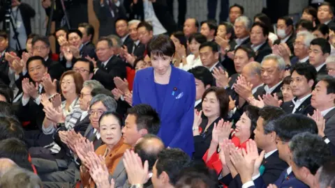 EPA Sanae Takaichi receives an applause after winning the LDP leadership election in Tokyo.