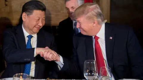AFP via Getty Images US President Donald Trump (R) and Chinese President Xi Jinping (L) shake hands during dinner at the Mar-a-Lago estate in West Palm Beach, Florida, on April 6, 2017.