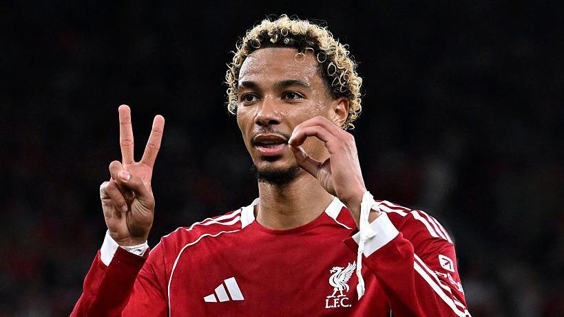 Liverpool striker Hugo Ekitike makes a hand gesture