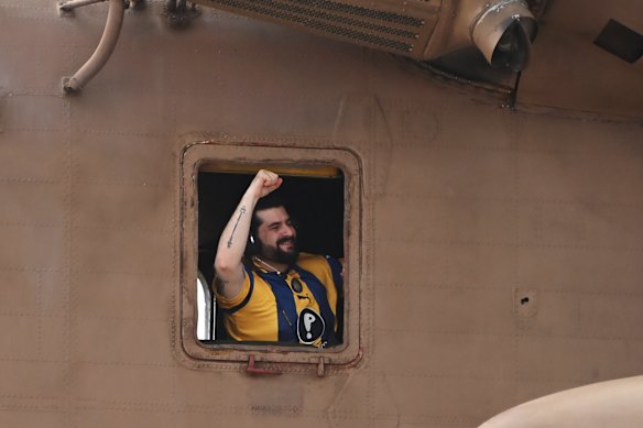 Gaza hostage Ziv Berman celebrates from a helicopter as he arrives at Chaim Sheba Medical Centre in Israel.