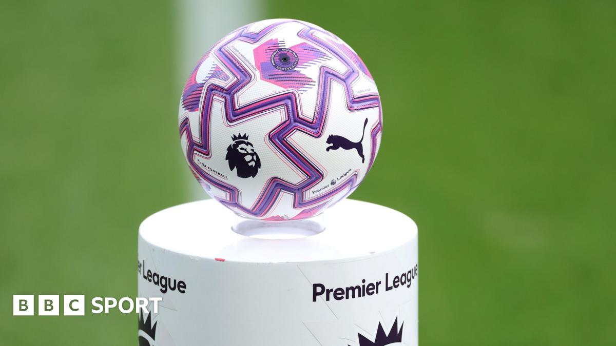 A Premier League ball sits on a pitchside plinth bearing the competition's name before kick-off at a match