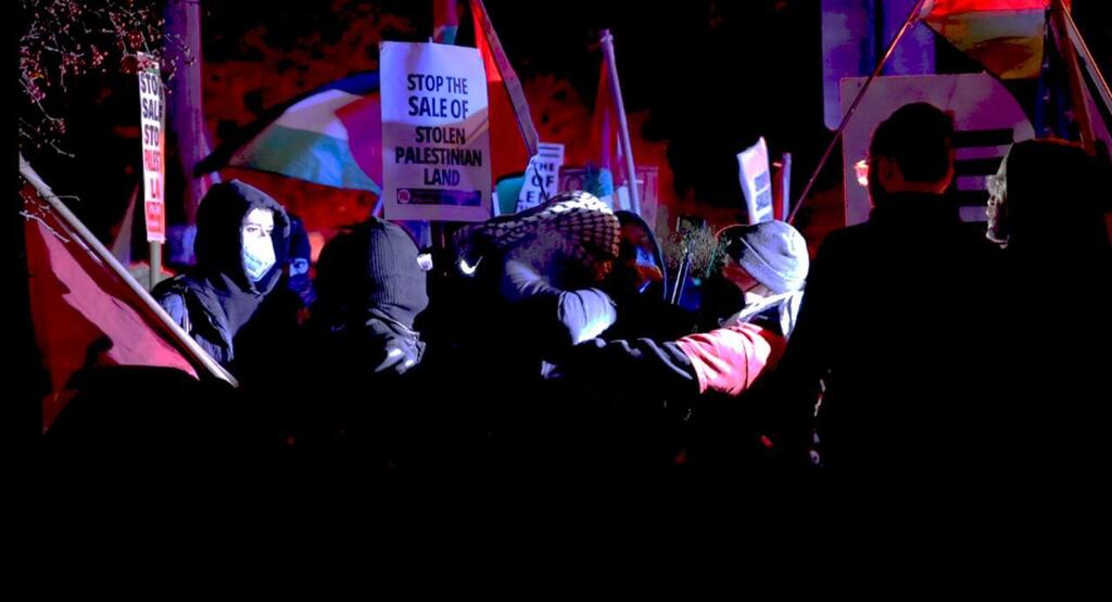 Protester Eric Camins points to David Silberberg shouting 'The Jew is here!' 