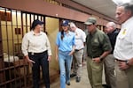 FILE - Homeland Security Secretary Kristi Noem, center, tours "Camp 57," a facility to house immigration detainees at the Louisiana State Penitentiary in Angola, La., with Louisiana Gov. Jeff Landry, third left, and ICE Deputy Director Madison Sheahan, left, Sept. 3, 2025.