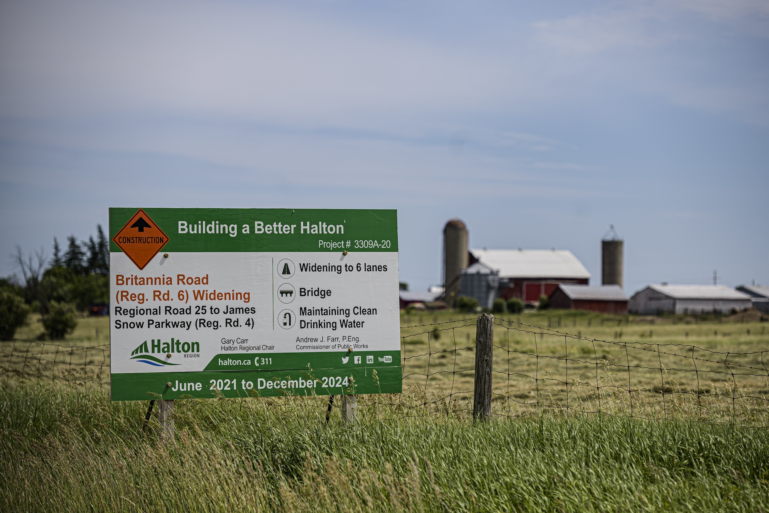 A sign near a farm in Halton Region, Ont., advises passers-by about the widening of a road.