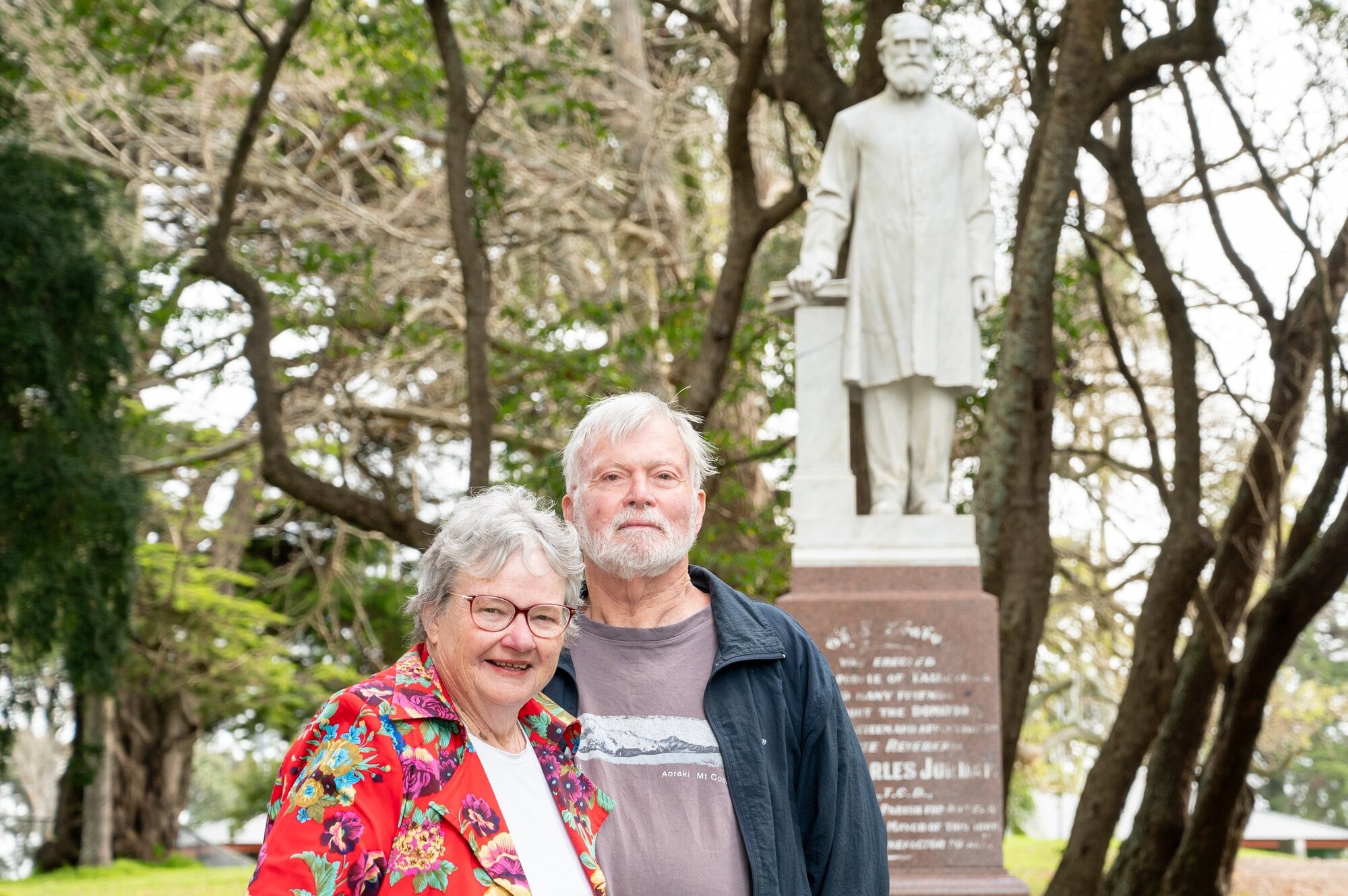  Jocelyn and Robert Mankelow with the statue of Reverend Canon Charles Jordan at Tauranga Domain.  Photo / Brydie Thompson