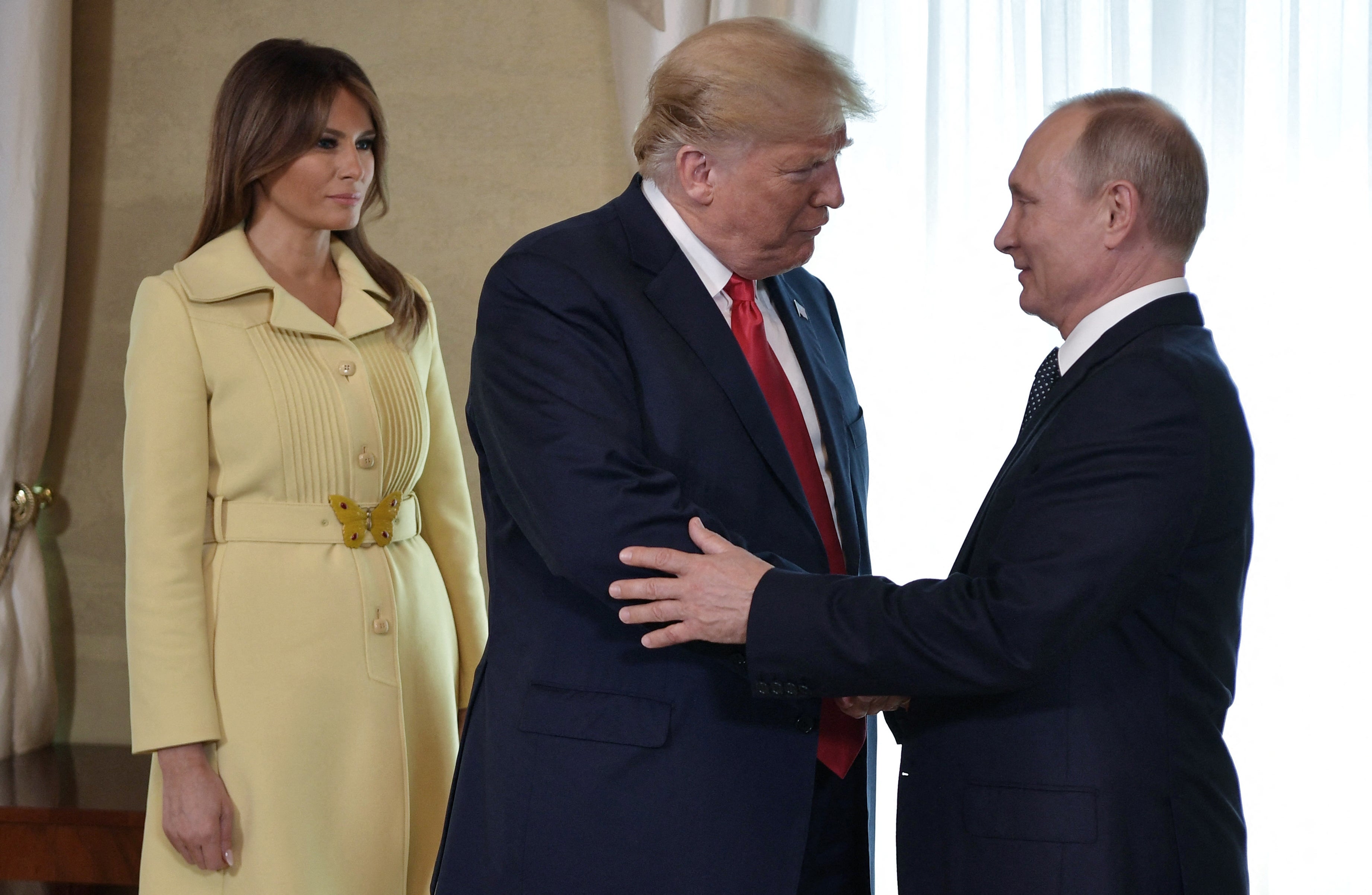 Melania Trump looks on as her husband greets Vladimir Putin ahead of a meeting in Helsinki, Finland, in July 2018
