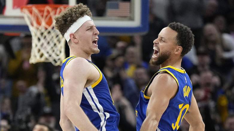 Warriors superstar Steph Curry celebrates with Brandin Podziemski