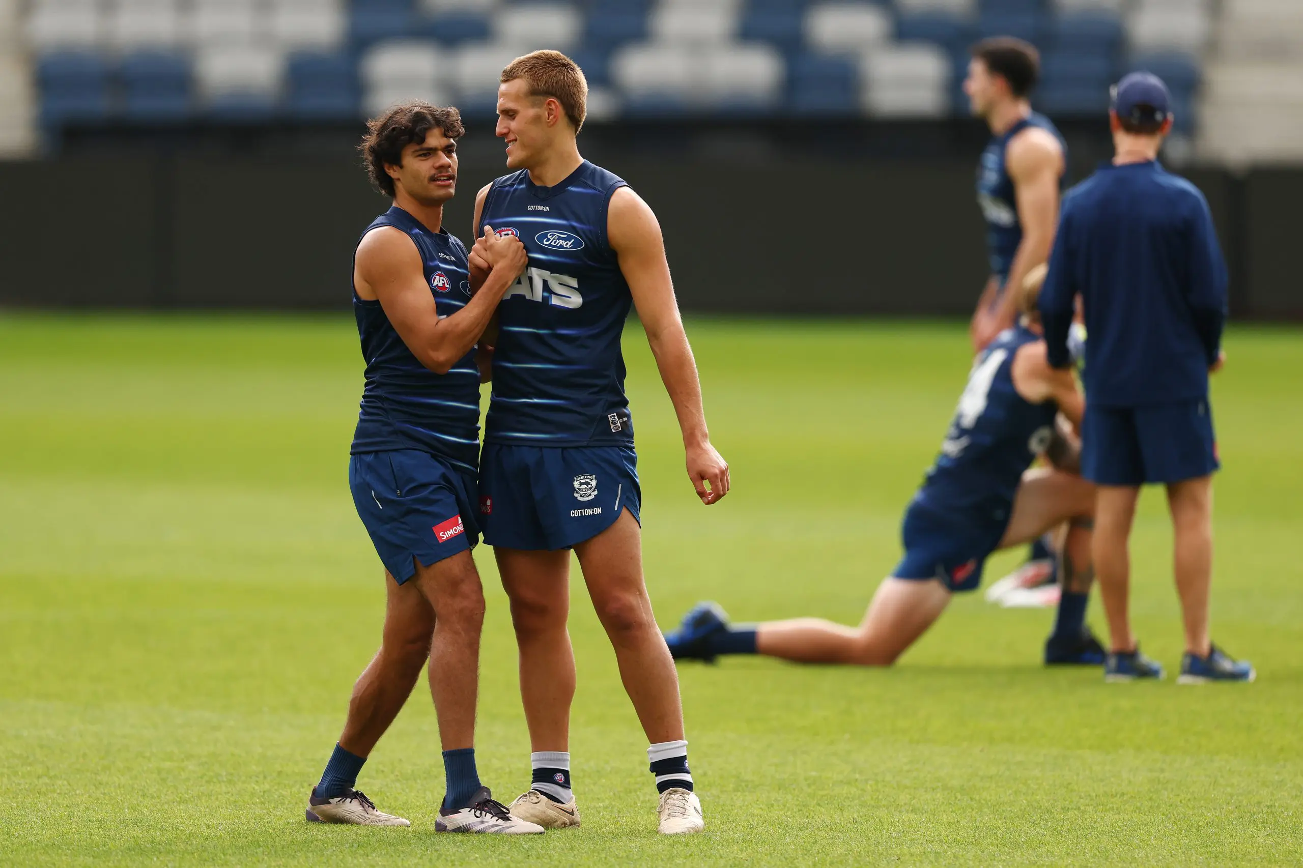 GEELONG, AUSTRALIA - FEBRUARY 19: Lawson Humphries and George Stevens of the Cats train during a Geelong Cats AFL training session at GMHBA Stadium on February 19, 2025 in Geelong, Australia. (Photo by Morgan Hancock/Getty Images)