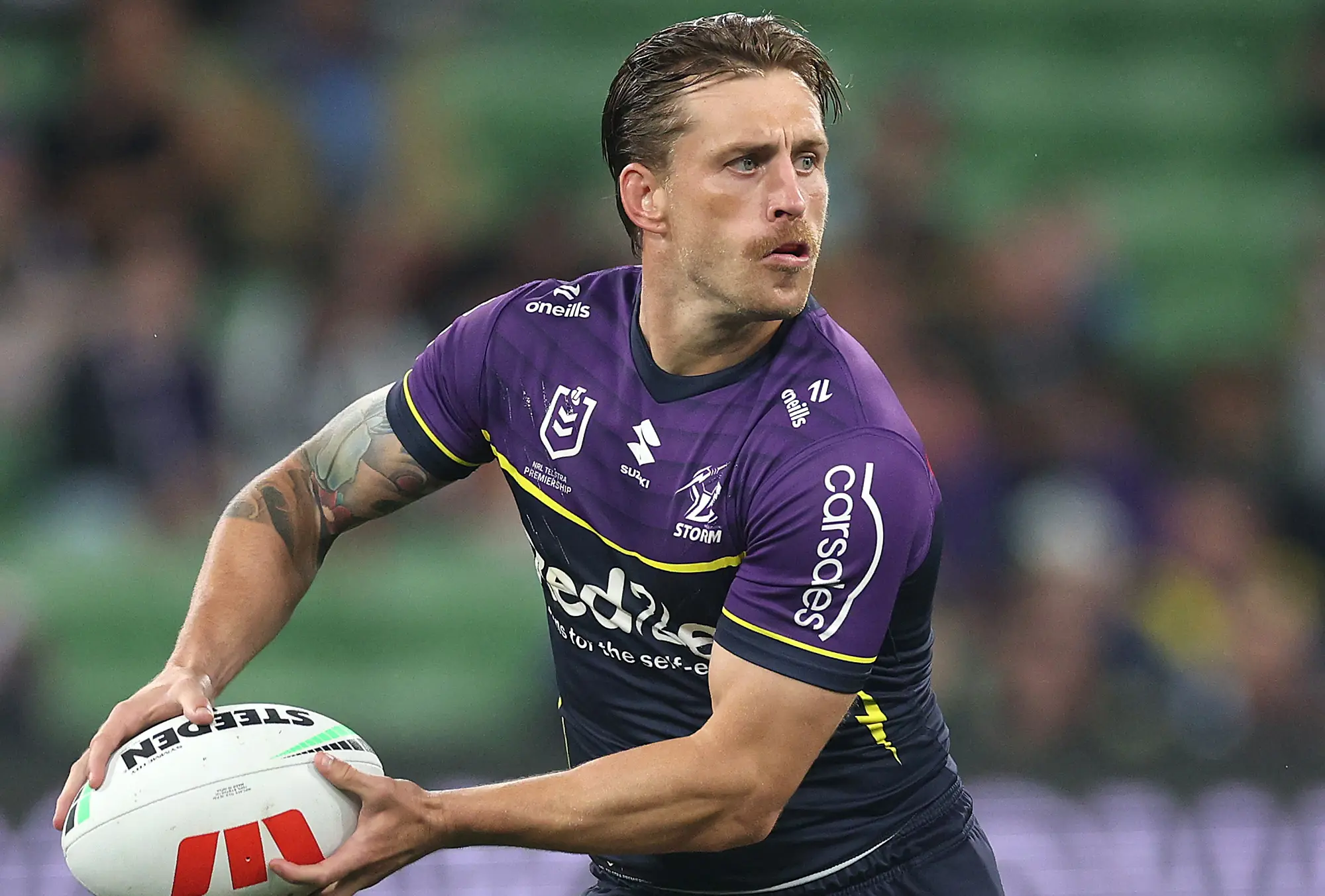 MELBOURNE, AUSTRALIA - MARCH 20: Cameron Munster of the Storm runs the ball during the round three NRL match between the Melbourne Storm and Penrith Panthers at AAMI Park on March 20, 2025, in Melbourne, Australia. (Photo by Daniel Pockett/Getty Images)