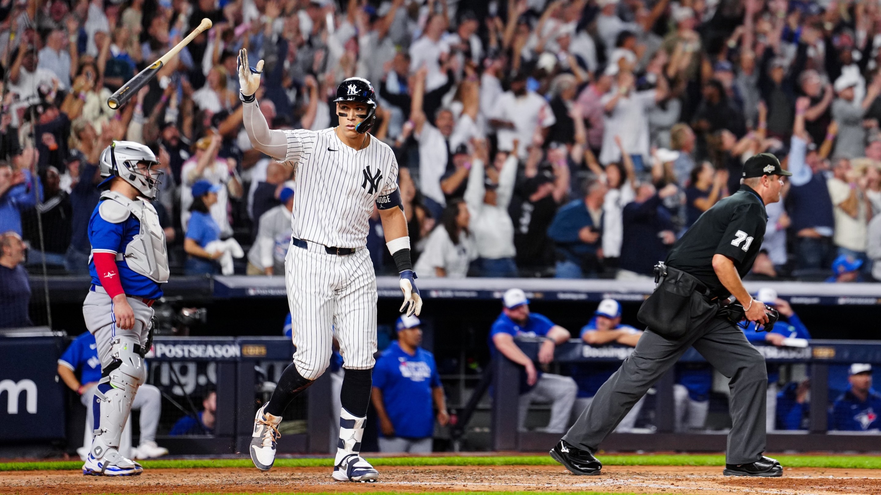 NEW YORK, NY - OCTOBER 07: Aaron Judge #99 of the New York Yankees hits a game-tying three-run home run in the fourth inning of Game Three of the American League Division Series presented by Booking.com between the Toronto Blue Jays and the New York Yankees at Yankee Stadium on Tuesday, October 7, 2025 in New York, New York. (Photo by Daniel Shirey/MLB Photos via Getty Images)
