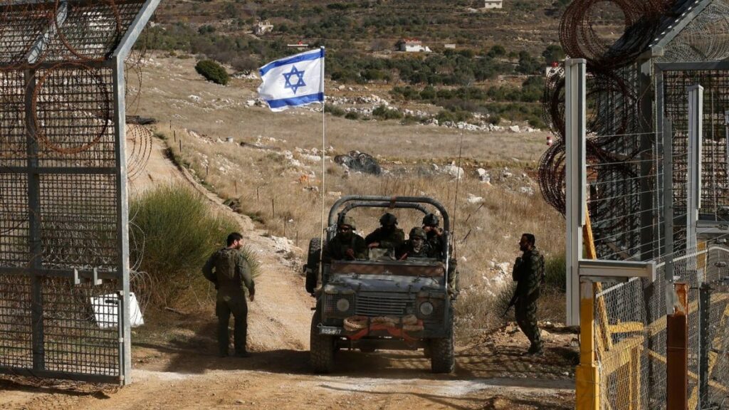 Israeli military vehicles returning from the buffer zone with Syria near the village of Majdal Shams in the occupied Golan Heights - 10 December 2024 (AFP)