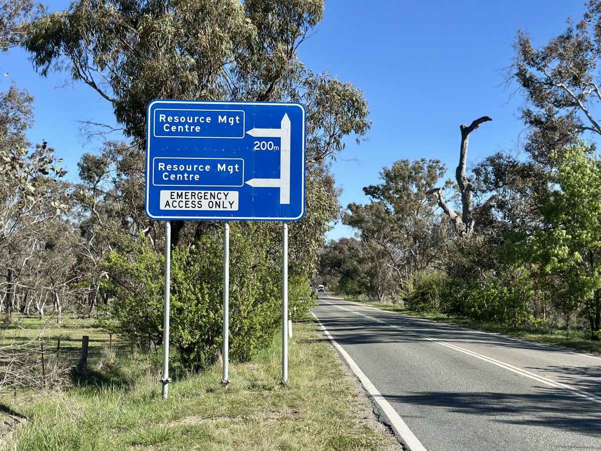 A blue and white road sign