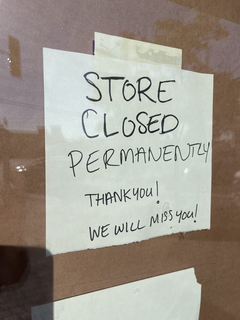 A sign that says "store closed permanently, we will miss you, thank you"