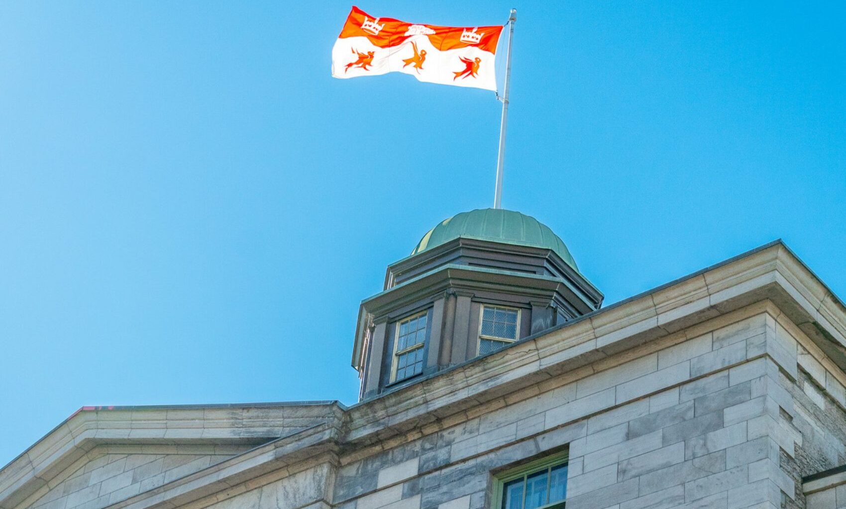 The Arts Building flag on a bright sunny day