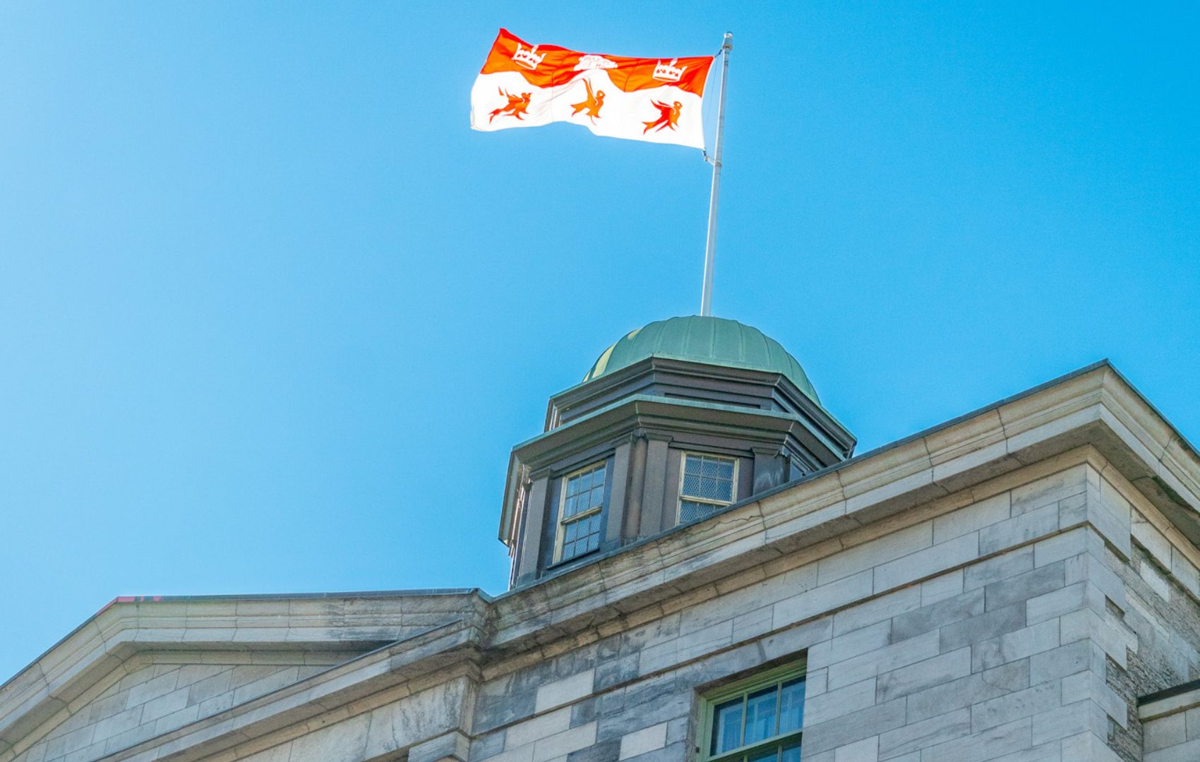 The Arts Building flag on a bright sunny day