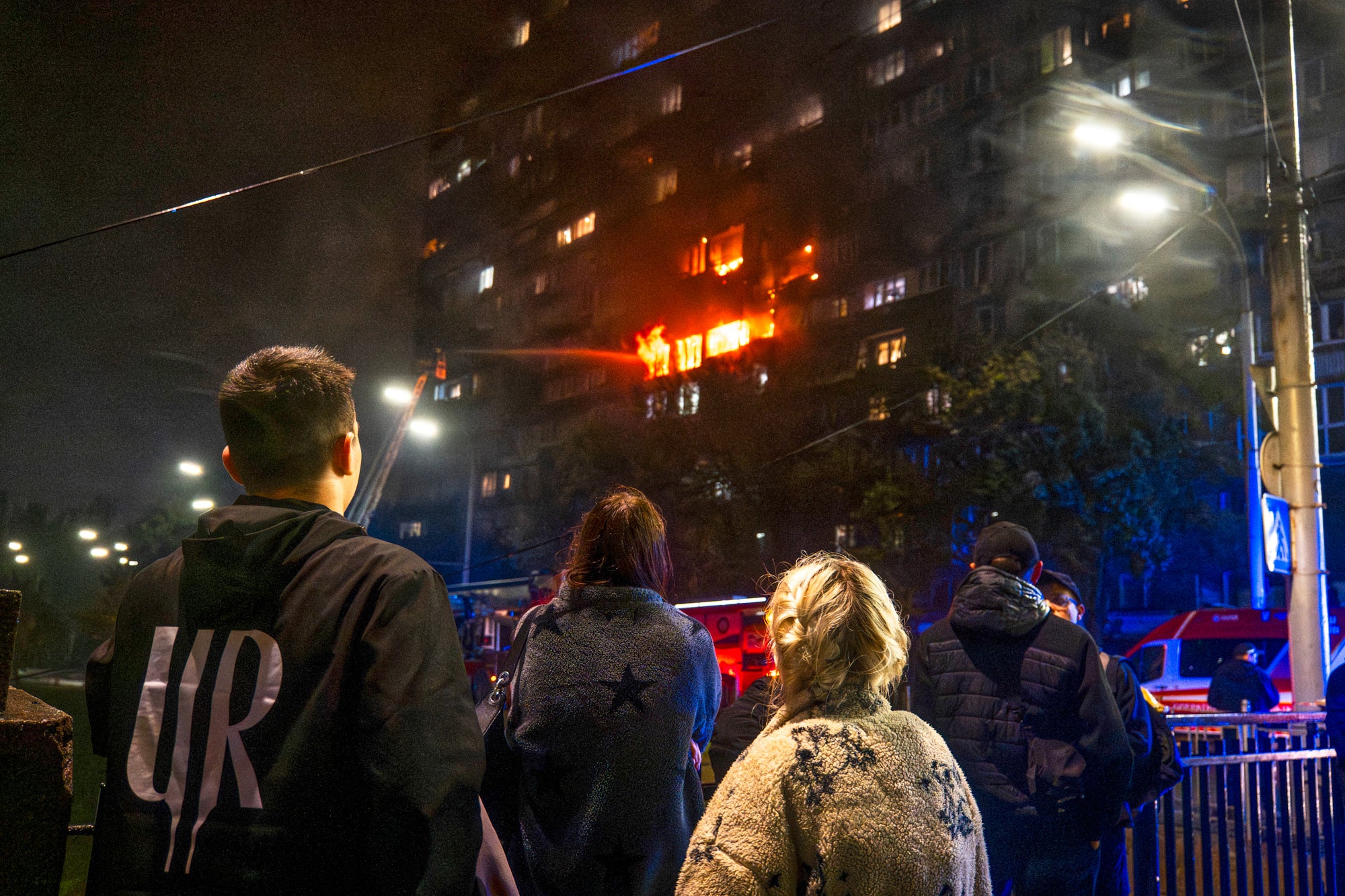 Firefighters battle a blaze following a Russian attack in Kyiv on Friday
