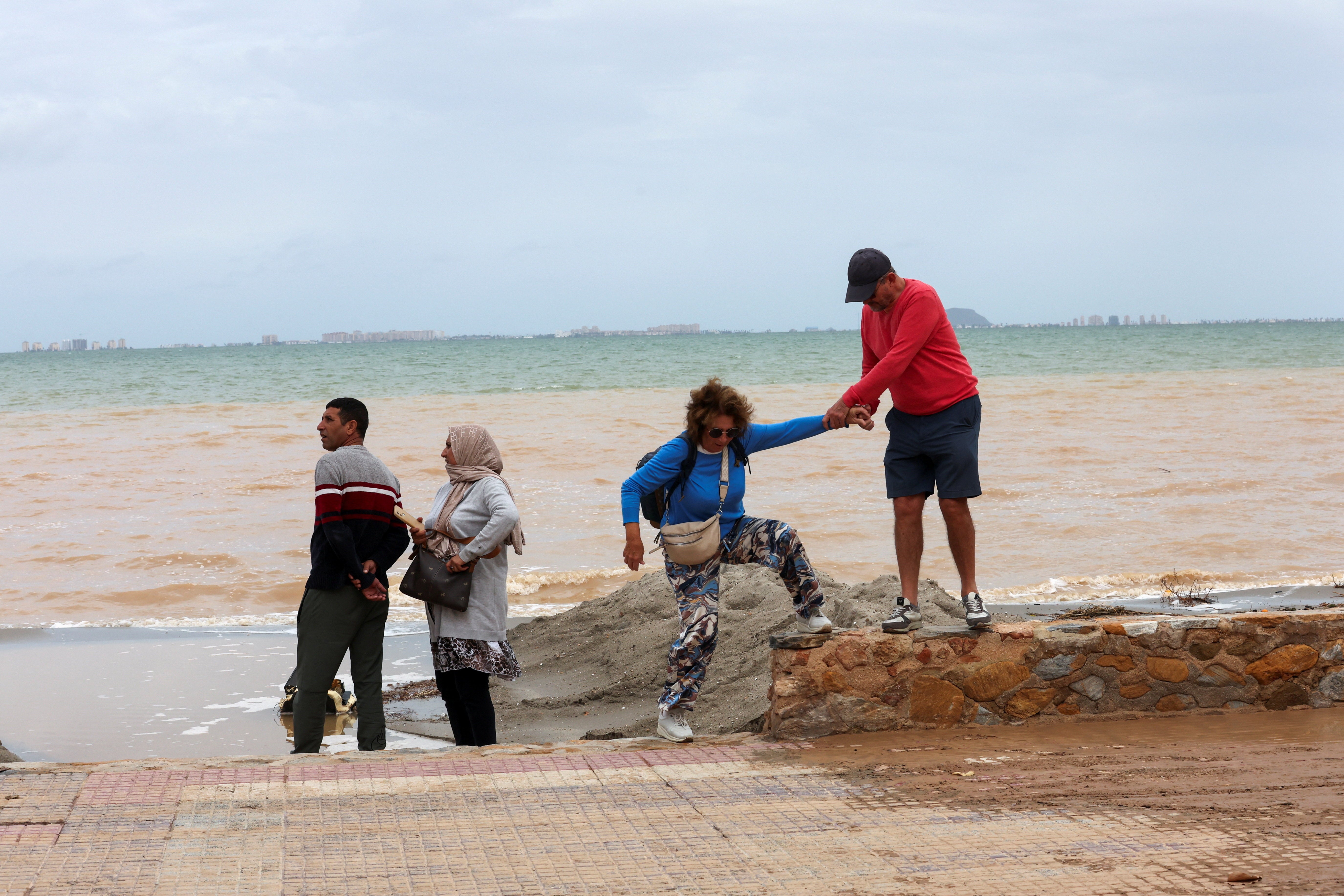 Sludge from the Campo de Cartagena reaches the Mar Menor lagoon in Los Alcazares after a day of heavy rain on Saturday
