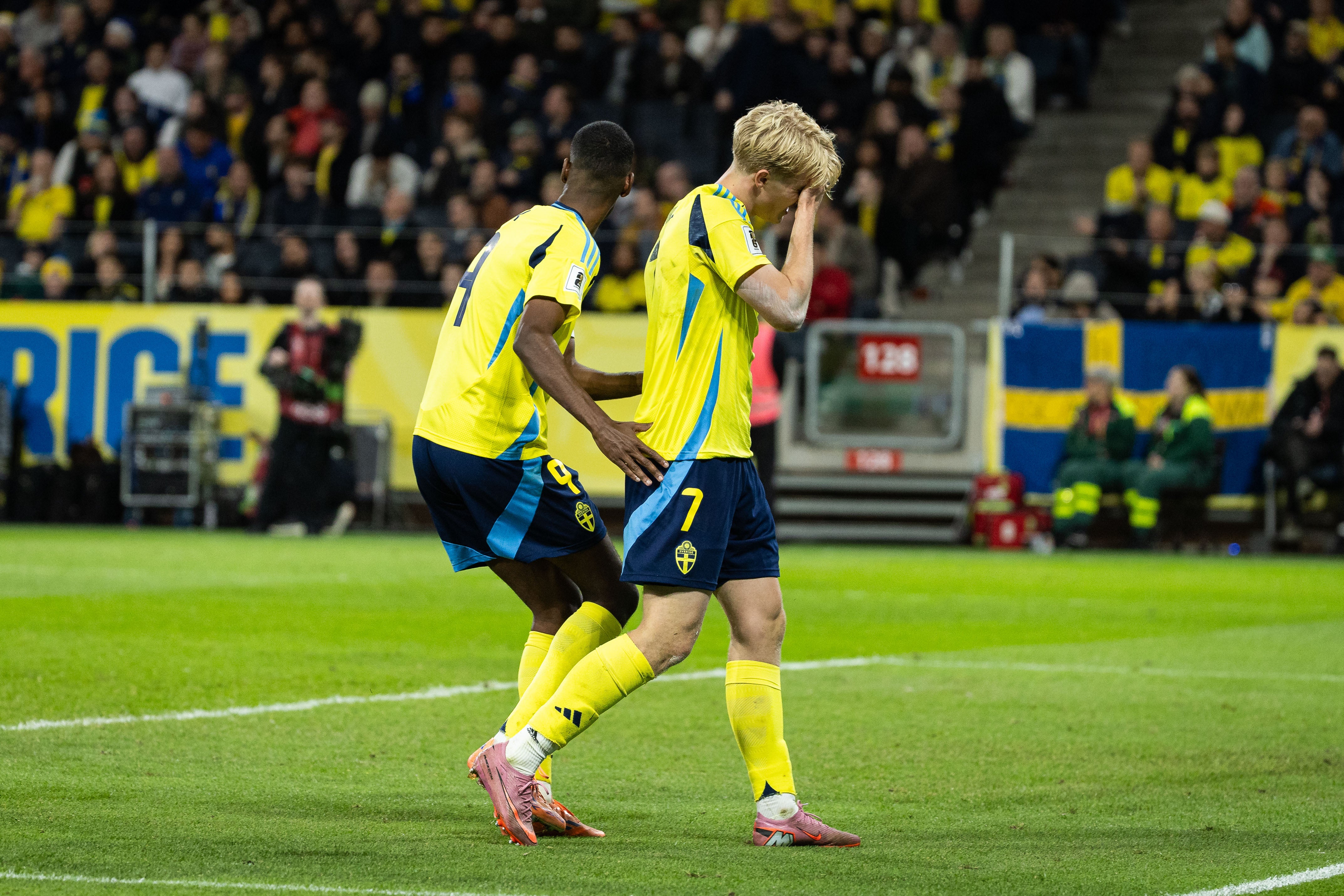 ...Isak consoles a stunned Bergvall after the missed open goal