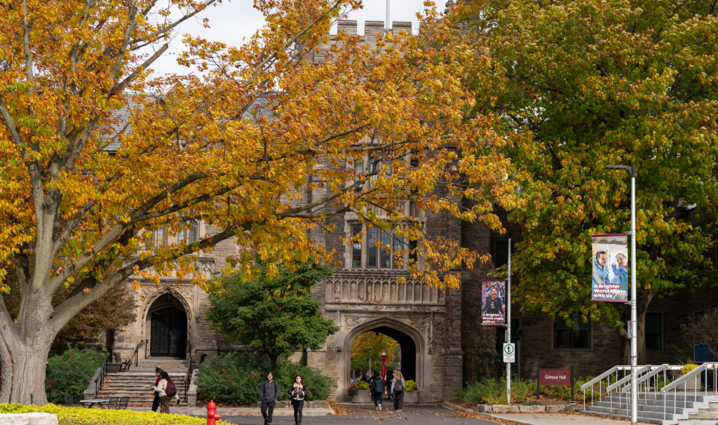 Trees with golden leaves in the fall frame University Hall.
