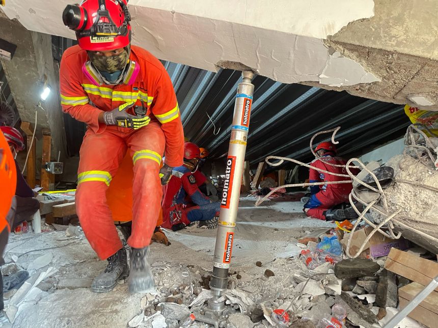 Rescuers search for victims trapped under the rubble on Wednesday.