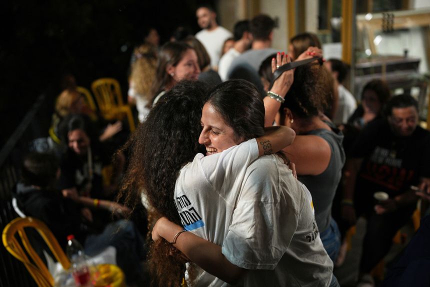Relatives and supporters of Israeli hostages held by Hamas celebrate after the ceasefire agreement announcement, as they gather at the hostages square in Tel Aviv, Israel, on October 9, 2025.