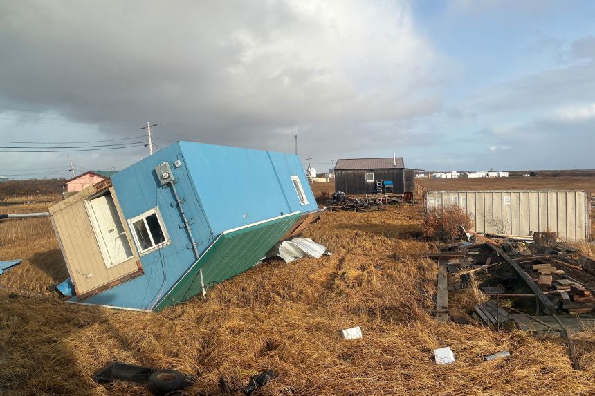 An unoccupied home rests on its roof after being knocked over in Kotlik on October 12 after the remnants of Typhoon Halong hit western Alaska.