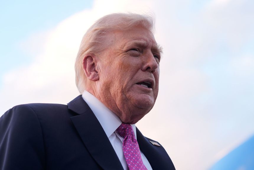 President Donald Trump pictured speaking to reporters after arriving in West Palm Beach, Florida, on Friday.