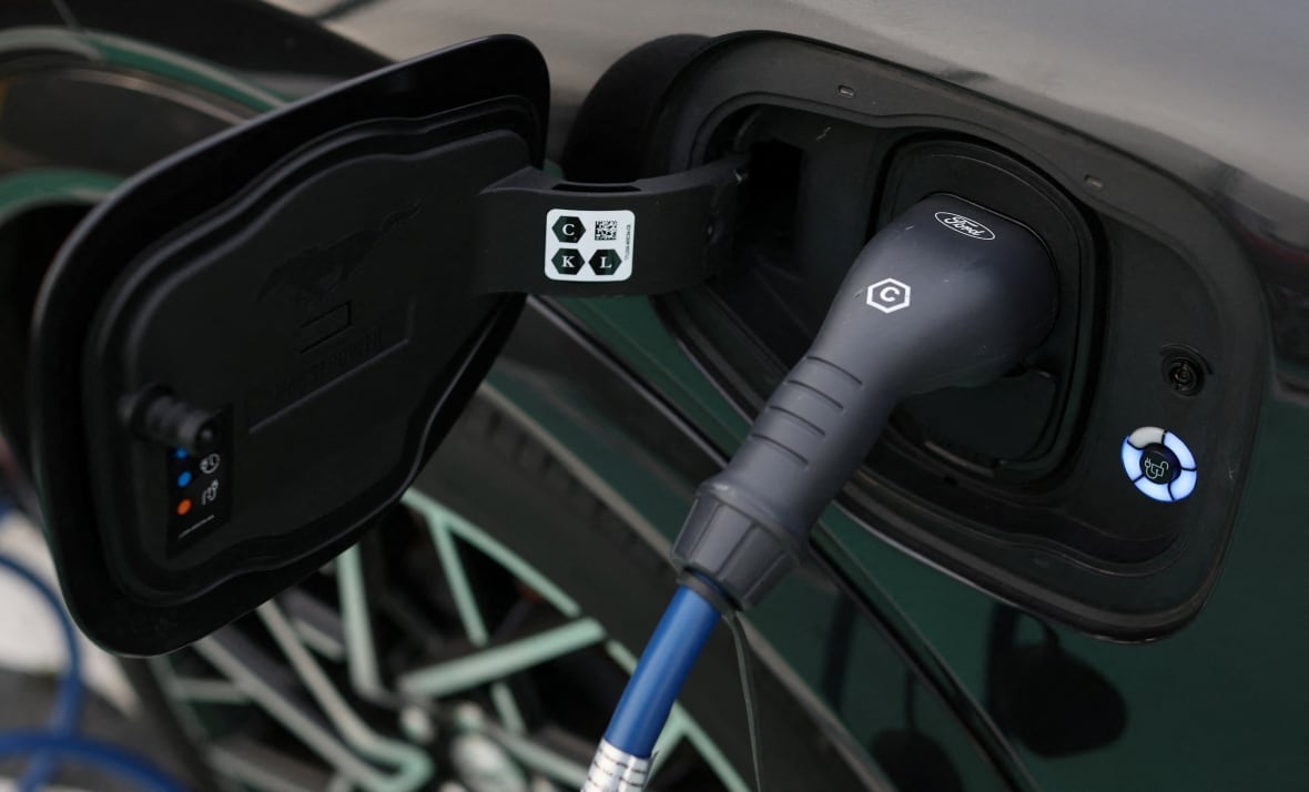 A Ford logo is seen on an electric vehicle charging cable during a press event at the Ford Halewood transmissions plant in Liverpool, Britain, December 1, 2022. 