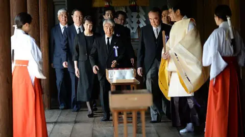Getty Images A group of politicians visiting Yasukuni Shrine