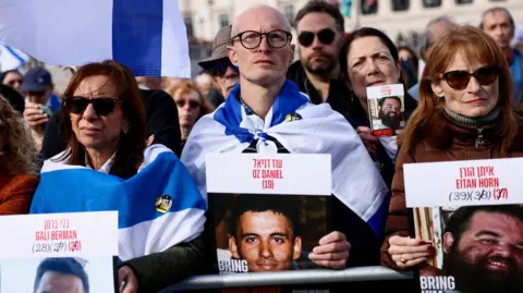 Reuters People attend a commemorative event ahead of the two year anniversary of the 7 October 2023 Hamas attack on Gaza.