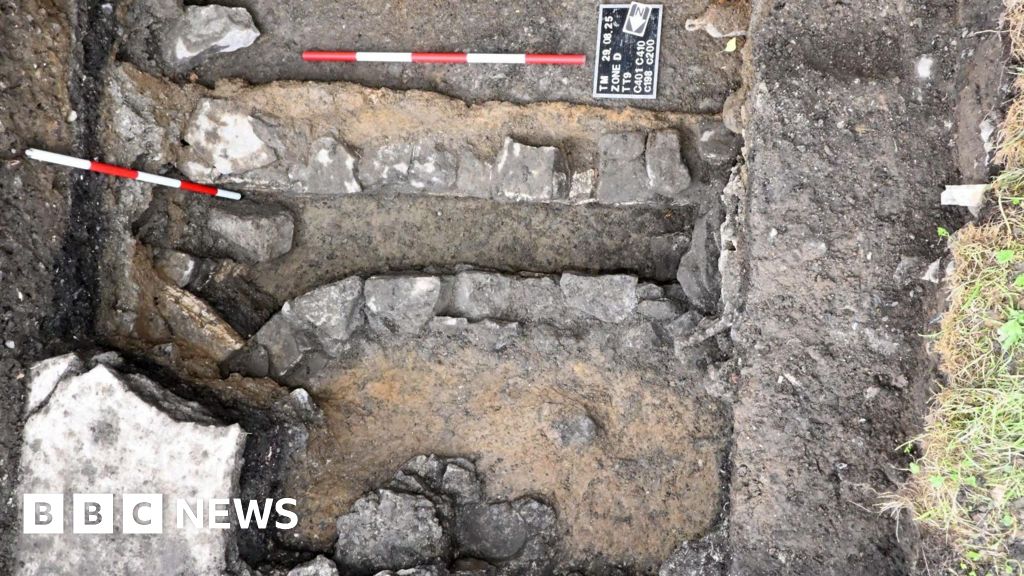 Personal items found during mass burial site excavation