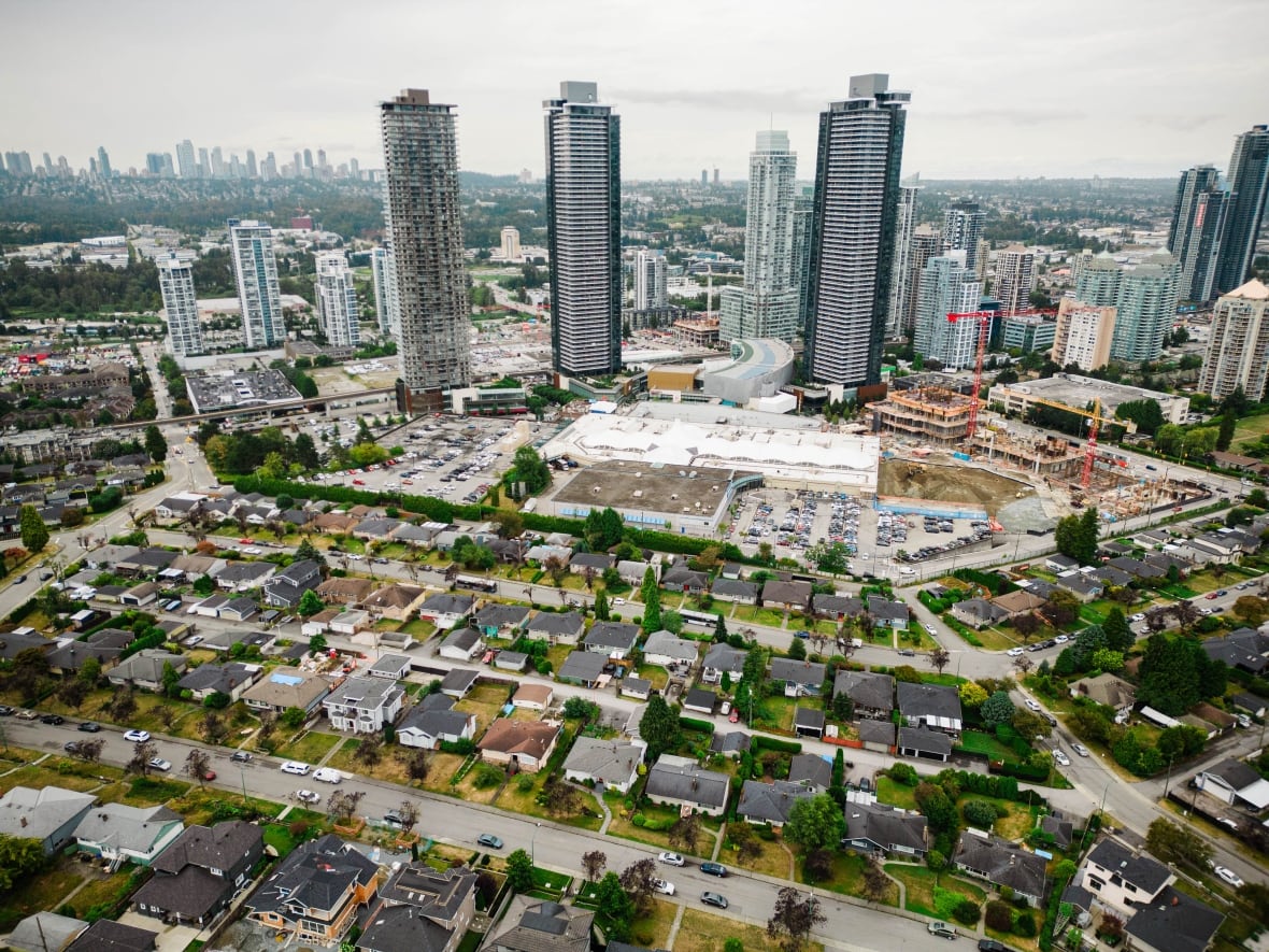 Highrise towers in Burnaby, B.C., at the Amazing Brentwood rise from the ground steps a block away from single-family homes.